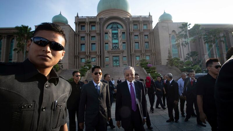 Malaysia’s new leader, Mahathir Mohamad (centre), arrives for his first monthly assembly as prime minister in Putrajaya on Monday. Photograph: Vincent Thian/AP