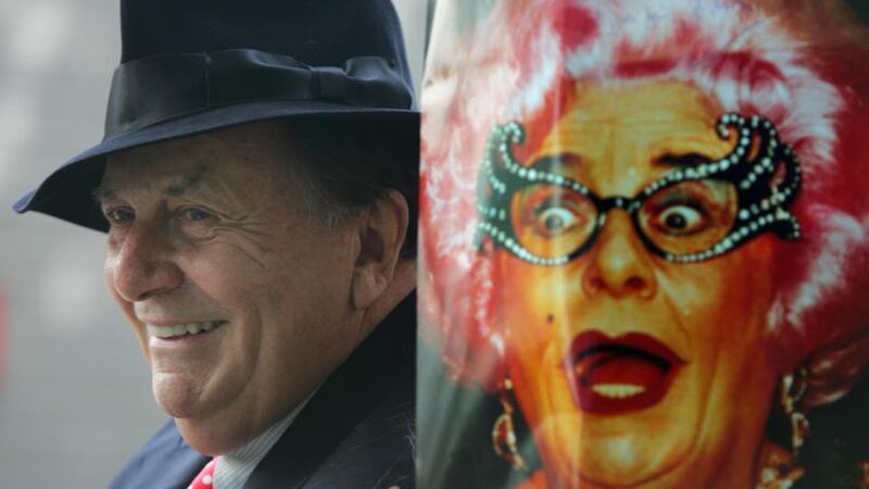 Above, the Australian comedian and TV show host Barry Humphries in Dublin in 2009, beside a poster of his alter-ego Dame Edna Everage. Photograph: Bryan O’Brien