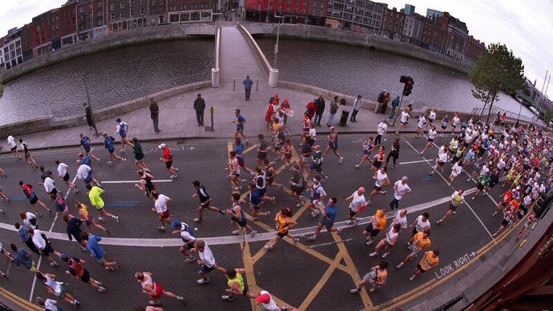 Runners go past the Millennium Bridge during the 2001 Dublin Marathon. Photo: Morgan Treacy/Inpho