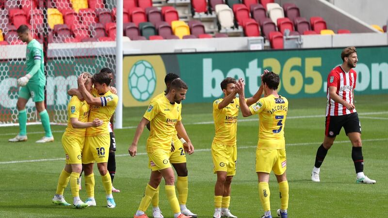 Daryl Horgan of Wycombe Wanderers celebrates with team-mates after scoring his team’s first goal during the Carabao Cup first-round match against Brentford. Photograph: Catherine Ivill/Getty Images