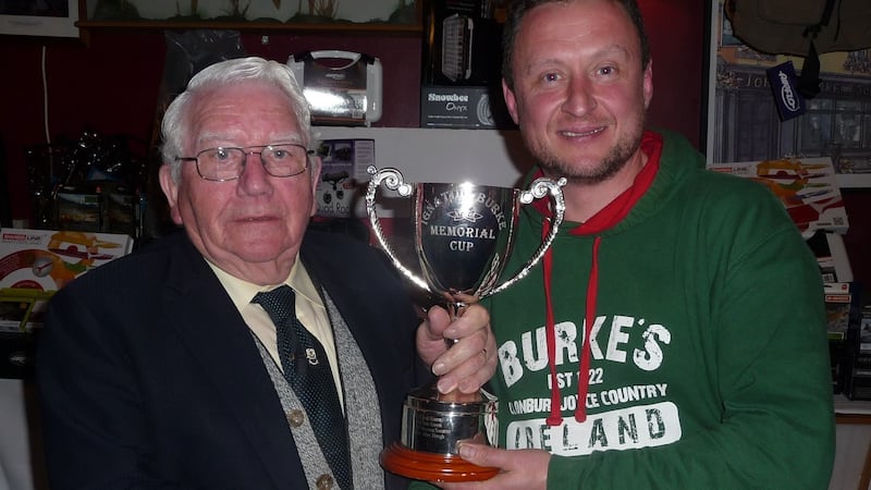 Nigel Greene, winner of 2017 Burke competition, receiving the Ignatius Burke Cup from Ciarán Burke.