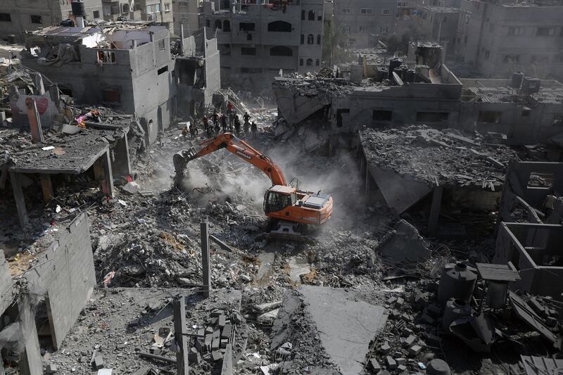 People look on as rubble left by Israel airstrikes is cleared in Khan Younis, in southern Gaza. Photograph: Yousef Masoud/The New York Times