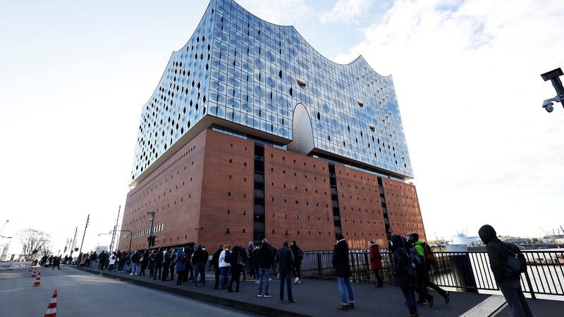 People stand in a reportedly 700-metre-long queue outside a vaccination centre in the Philharmonic Hall in Hamburg, Germany on Monday. Photograph: Morris Mac Matzen/AFP via Getty Images