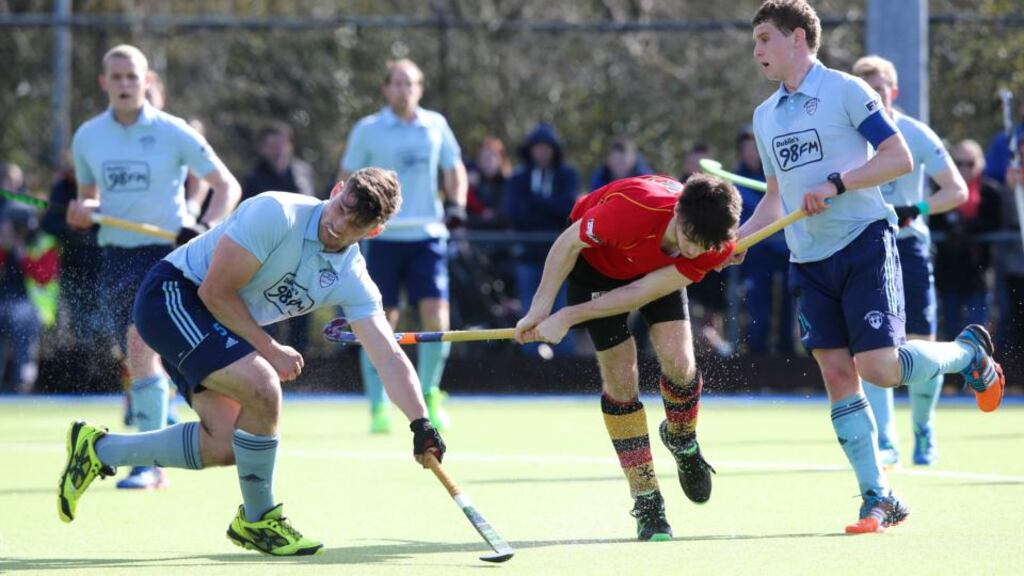 Monkstown’s Richard Sykes attempts to block a shot from Johnny McKee of Banbridge in the Irish Hockey League final, claimed by the south Co Dublin team. Photograph: Gary Carr/INPHO