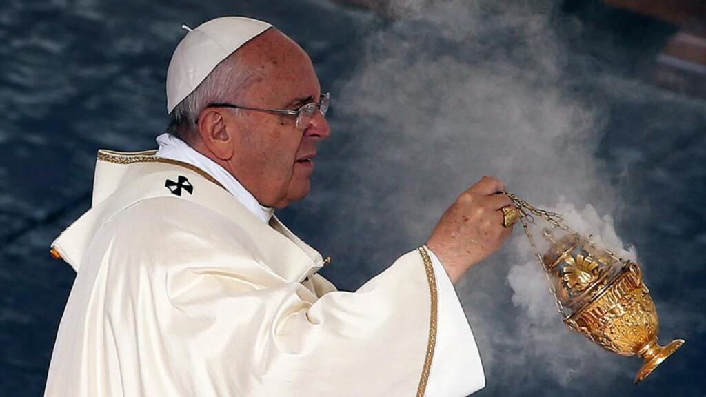 Pope Francis swings an incense thurible during a canonisation ceremony to elevate six men and women to sainthood, in St Peter’s square at the Vatican on Sunday. Photograph: Alessandro Bianchi/Reuters