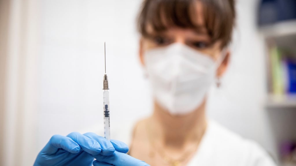 A health worker prepares a dose of Pfizer-BioNTech vaccine. File photograph: Tibor Rosta/MTI via AP