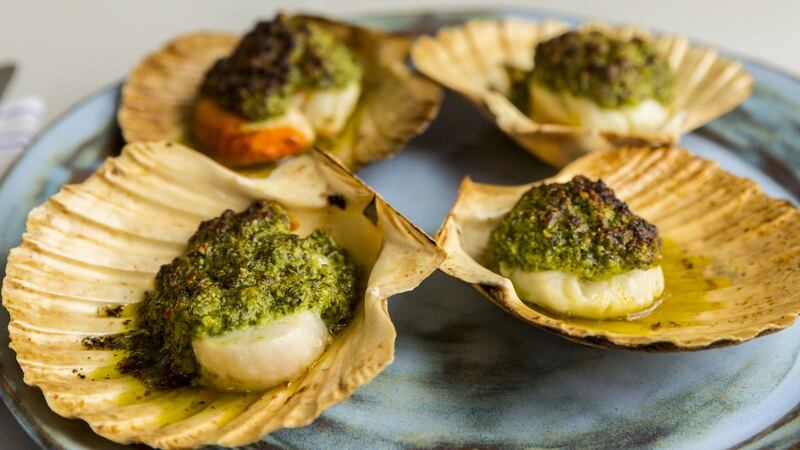 Grilled scallops with pumpkin seed, chilli and coriander sauce. Photograph: Emma Jervis