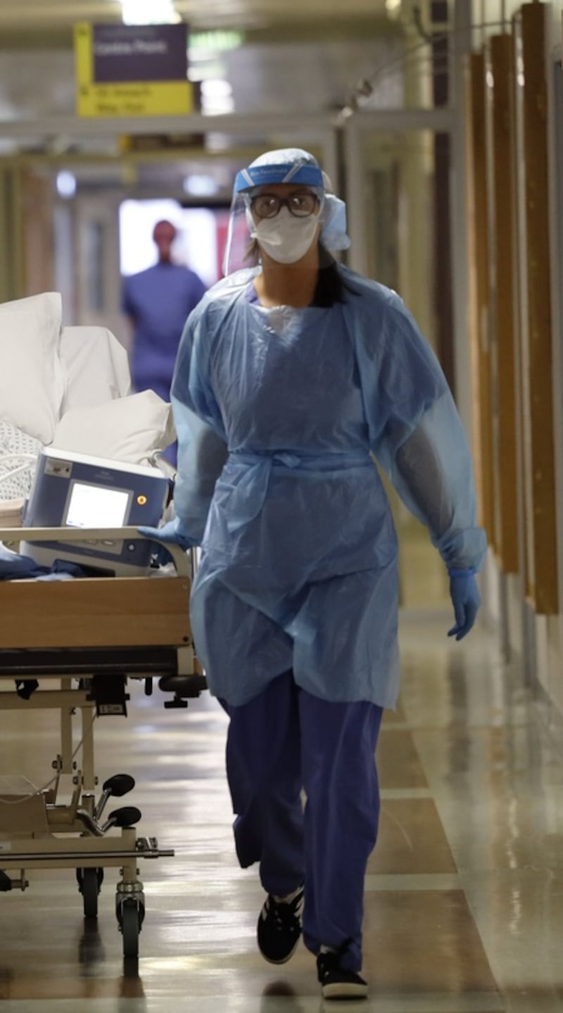 A Covid patient is transferred   along the hospital corridors with medical staff  at St Vincent’s hospital in March 2020. One year one, the virus has caused some 4,000 deaths and infected more than 200,000 in the Republic. Photograph: Alan Betson