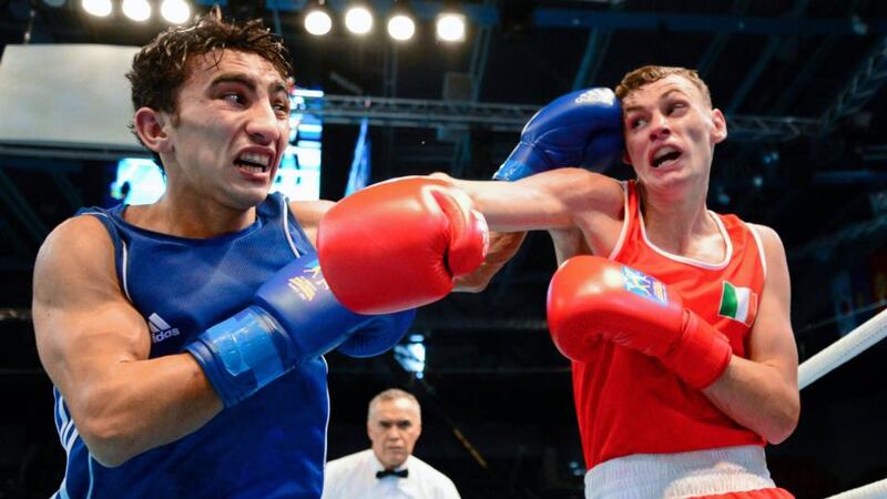 Elvin Isayev of Azerbaijan lands a left  to the head of Ireland’s  Seán McComb during their  Lightweight  Last 16 bout at the World Boxing Championships in Almaty, Kazakhstan. Photograph: Paul Mohan/Sportsfile