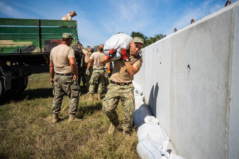 Romanian soldiers build a bomb shelter in the village of Plauru, the Danube Delta, an area where drone fragments have been found. Photograph: MIHAI BARBU/AFP via Getty Images