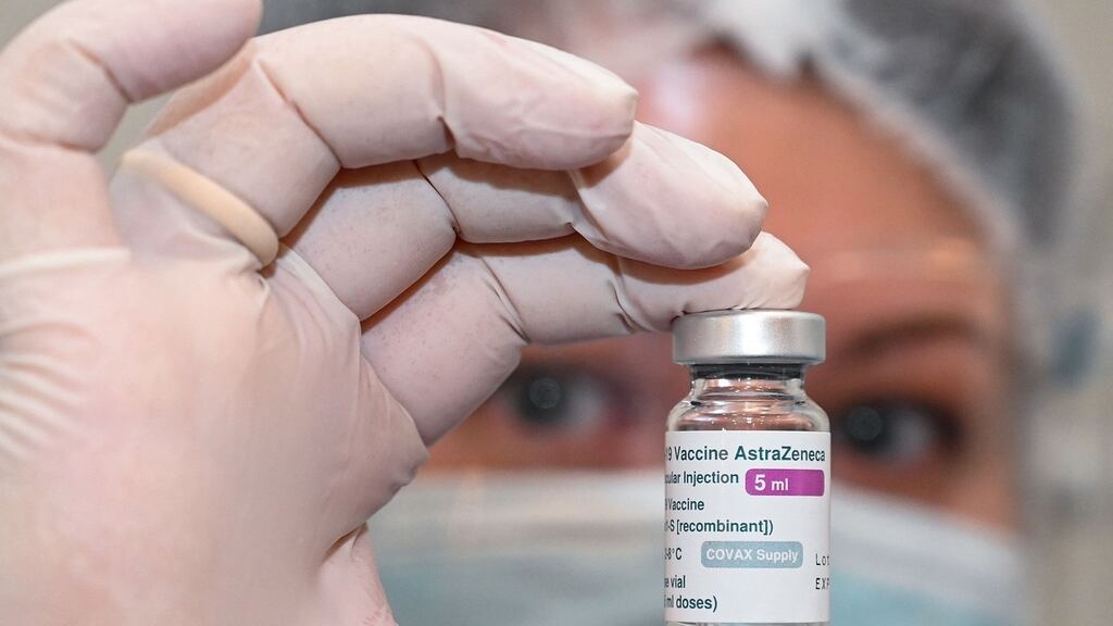 A nurse holds a vial of the Oxford-AstraZeneca vaccine against the coronavirus disease at an infectious diseases hospital in Tbilisi. Photograph:  Vano Shlamov/ AFP via Getty