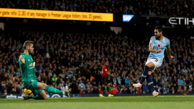 Manchester City’s Ilkay Gundogan scores their third goal in the Premier League match against Manchester United at the Etihad stadium . Photograph: Darren Staples/Reuters