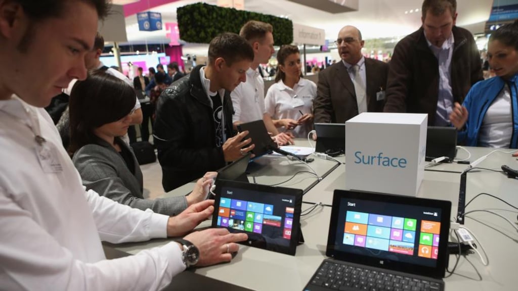 Visitors try out Windows 8 Surface tablet computers at the Microsoft stand at the 2013 CeBIT technology trade fair earlier this month in Hanover, Germany. Photograph: Sean Gallup/Getty