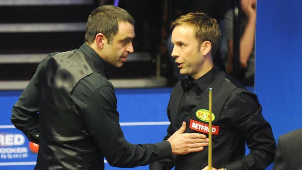 Ronnie O’Sullivan congratulates Ali Carter after his 13-9 win at the Crucible. Photograph: Rui Vieira/PA