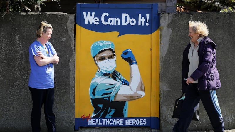 A mural by the artist Emmalene Blake on a gate in Dublin that appeared during the Covid pandemic. Photograph: Brian Lawless/PA