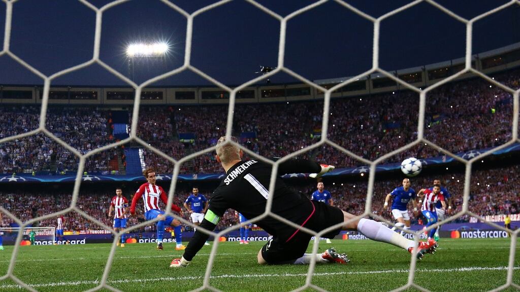 Atletico Madrid’s Antoine Griezmann scores from the penalty spot against Leicester City goalkeeper Kasper Schmeichel during the Champions League quarter-final first leg at the Vicente Calderon Stadium. Photograph:  Sergio Perez/Reuters/Livepic