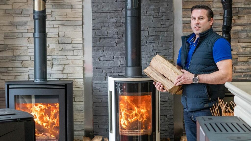Wayne Hurst of Hurst Heating and Plumbing Supplies in Castlebar, with some of the wood-burning stoves which have been selling well following the bituminous coal ban. Photograph: Keith Heneghan