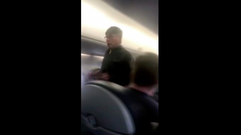 The man returned to the plane after his removal, insisting he needed to go home. Photograph: Audra Bridges via AP