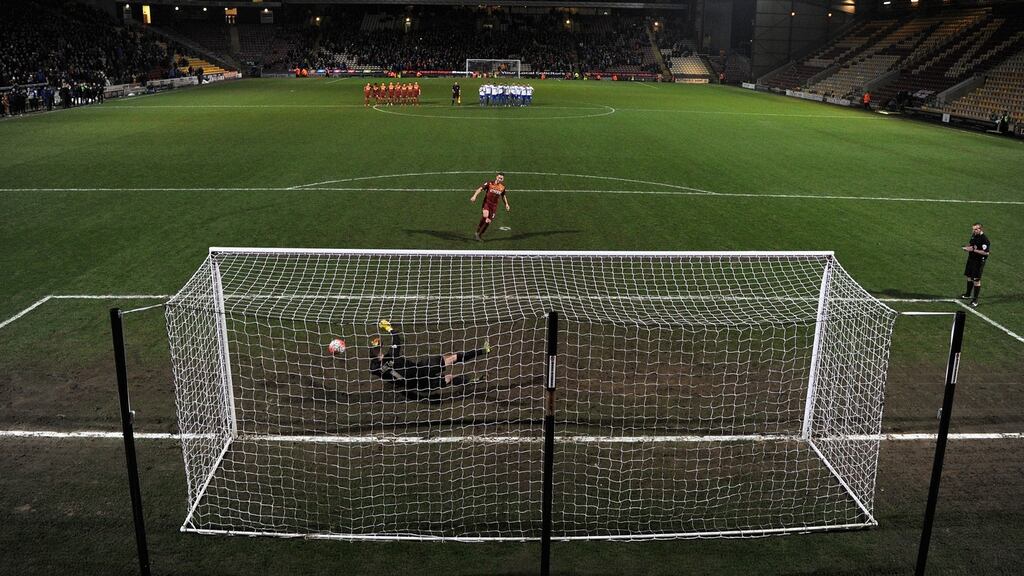 Bury goalkeeper Ian Lawlor saves Steve Davies’s penalty as his side defeated Bradford City in the FA Cup on Tuesday. Photograph: Gareth Copley/Getty Images