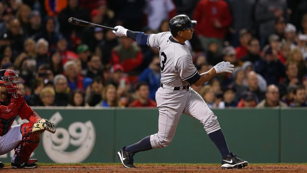 Alex Rodriguez hits his 660th career home run to tie Willie Mays record during a game with Boston Red Sox in the 8th inning at Fenway Park Boston, Massachusetts. Photo: Jim Rogash/Getty