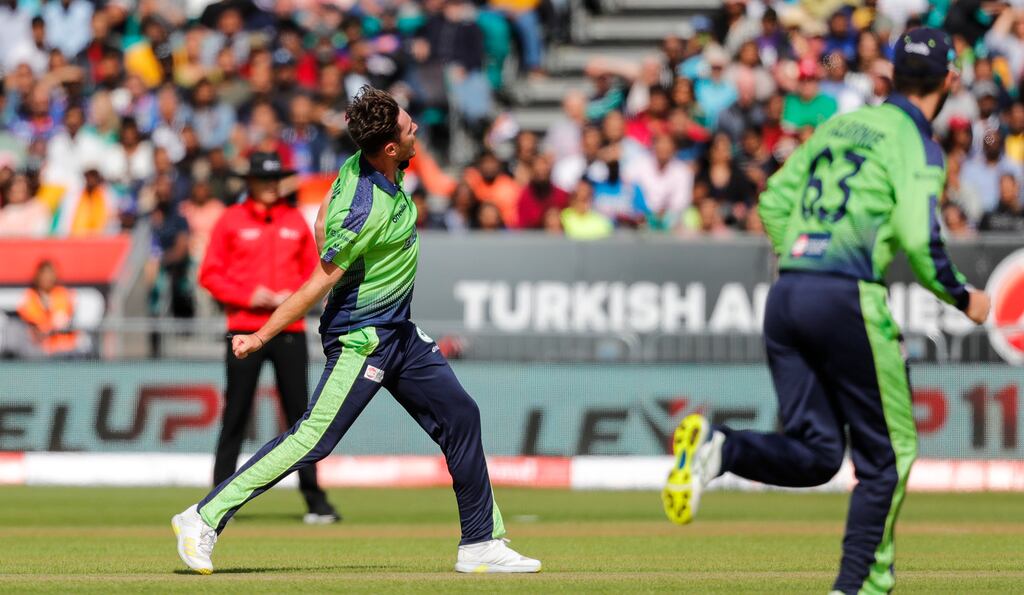 Mark Adair celebrates after dismissing India's Ishan Kishan. Photograph: Ben Whitley/Inpho
