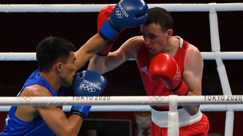 Brendan Irvine (red) and Philippines’ Carlo Paalam. Photo: Luis Robayo/AFP via Getty Images