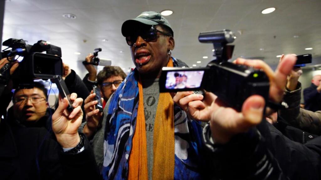Former NBA basketball player Dennis Rodman talks to the media at Beijing International Airport before leaving for Pyongyang. Photograph: Petar Kujundzic/Reuters