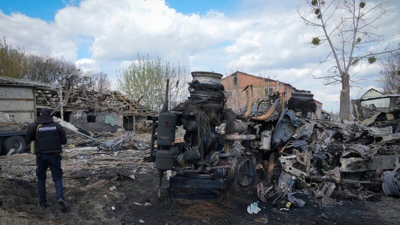 A police officer inspects a destroyed area following a Russian missiles attack on Thursday in Fastov, south of Kyiv. Photograph: Efrem Lukatsky/AP