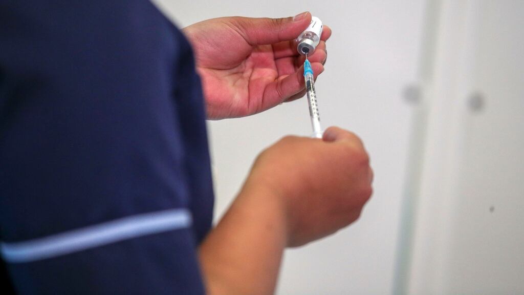 A nurse prepares a dose of the Pfizer/BioNtech Covid-19 vaccine at a NHS vaccine centre that has been set up in the grounds of Epsom Racecourse in Epsom, England. Photograph: Steve Parsons/WPA Pool/Getty Images.