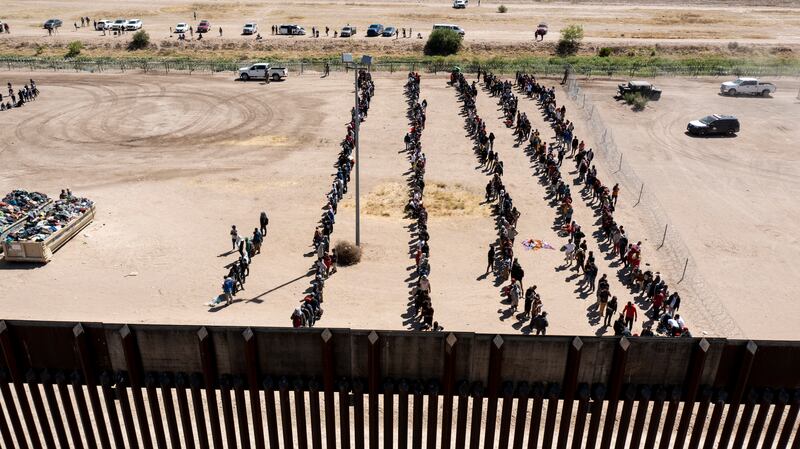 Migrants wait in lines to be processed by US Border Patrol agents after crossing from Ciudad Juarez, Mexico, into El Paso, Texas. Photograph: Ivan Pierre Aguirre/The New York Times