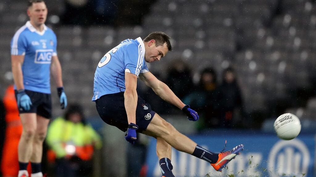 Dublin’s Dean Rock kicks a point to level the game against Tyrone. Photograph: Tommy Dickson/Inpho