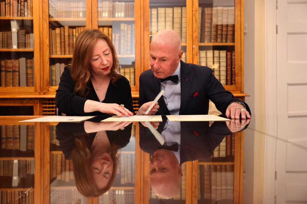 Bernárd Lynch, looking over letters with Katherine McSharry, acting director of the National Library of Ireland to mark the acquisition of his personal papers. The Ennis-native, renowned HIV/AIDS activist who rose to prominence for his human rights at pastoral work with LGBTI+ communities in New York in the 1980s. Photograph: Dara Mac Dónaill / The Irish Times