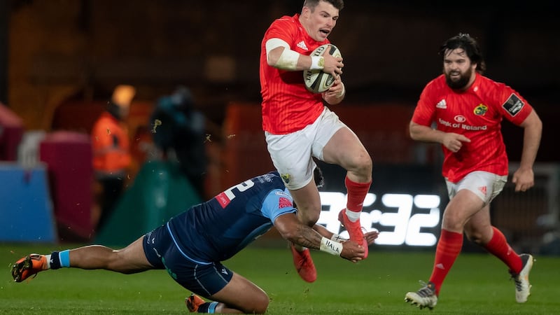 Munster’s Calvin Nash is tackled by Willis Halaholo of Cardiff Blues during the Guinness Pro 14 game at Thomond Park. Photograph: Morgan Treacy/Inpho