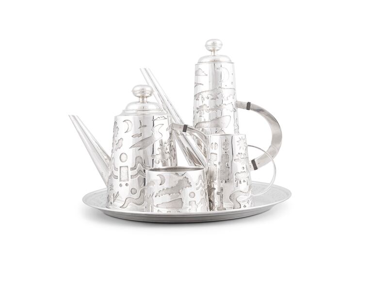 A tea and coffee service with a coffee pot, teapot, cream jug and sugar bowl