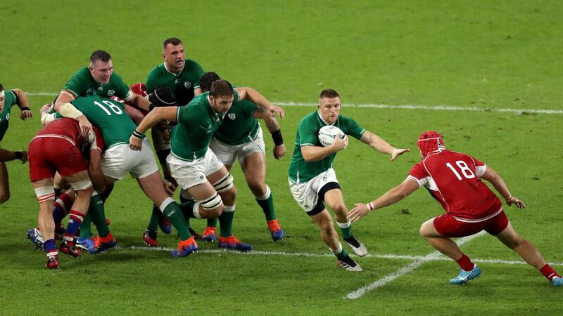 Andrew Conway looks to break past Vladimir Podrezov during Ireland’s win over Russia. Photograph: Mike Hewitt/Getty