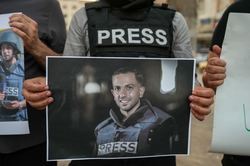 A journalist holds a picture of Palestinian journalist and Al Jazeera correspondent Anas al-Sharif who was killed by Israel's military in what it described as a targeted strike. Photograph: EPA