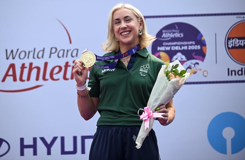 During her race last week, Comerford had bright blue ribbons tied to both shoes in memory of her childhood friend Elaine Moran. Photograph: INPHO/ TockoMackic
