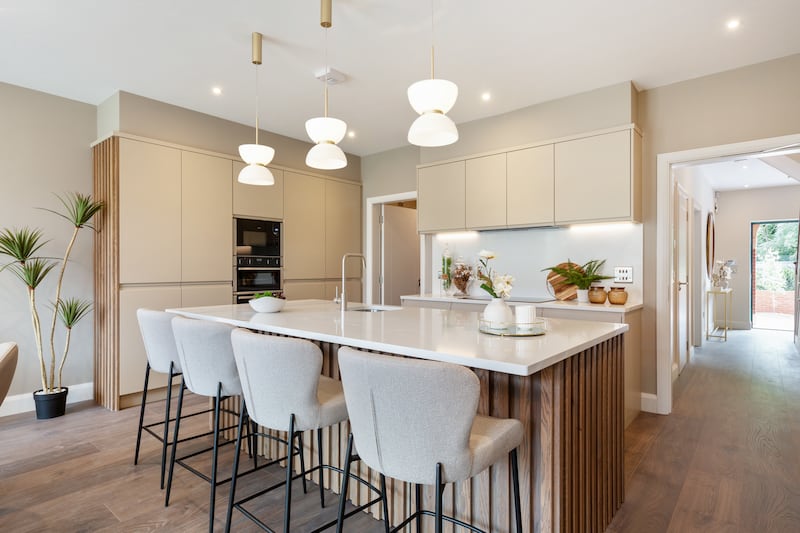 Kitchen by Cawley's with quartz-topped island