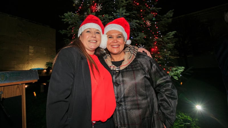 Sinn Féin TD Louise O Reilly (left) and party president Mary Lou McDonald TD during a turning on for the Oireachtas Christmas tree lights at Leinster House, Dublin Photograph: Gareth Chaney/Collins