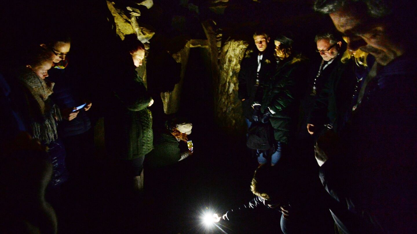 Lucky Winter Solstice lottery winners in the chamber at Newgrange. Photograph: Alan Betson/The Irish Times