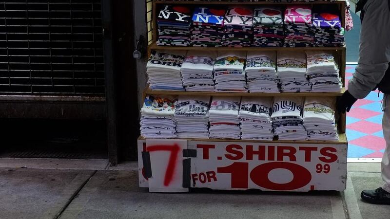 A shop in New York advertising cheap clothes. Bottom right: Lesley Dunne of Sirona. Photograph: Spencer Platt/Getty Images