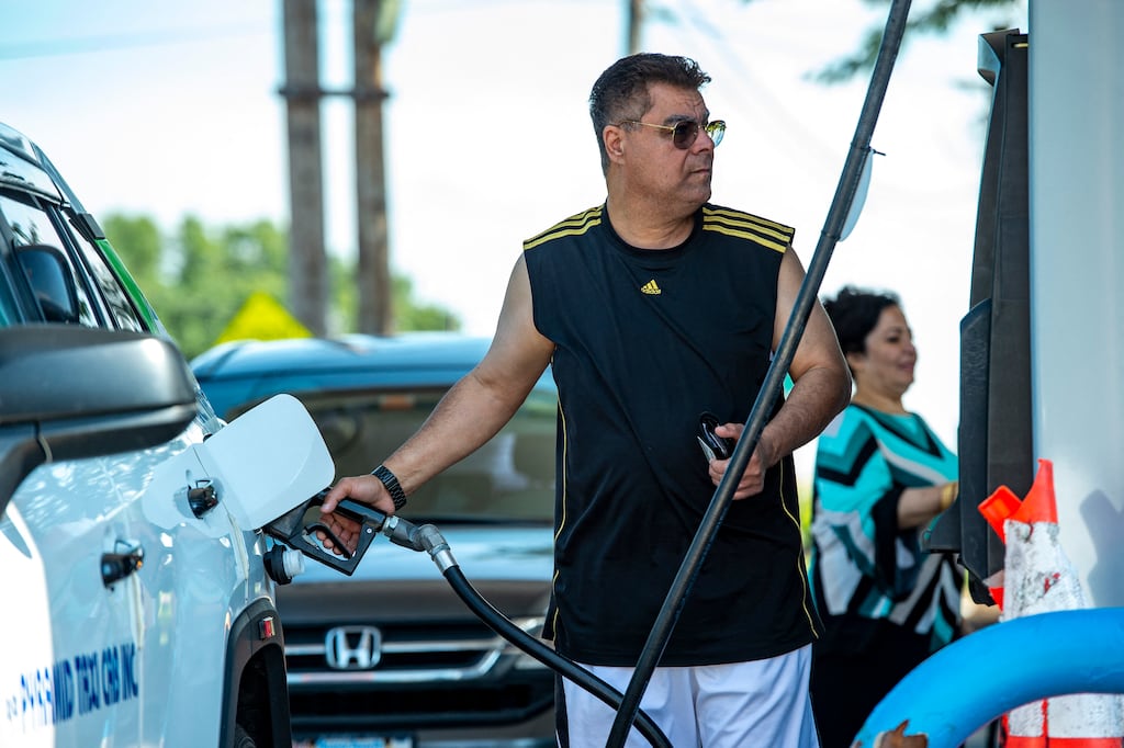 A motorist pumps petrol at a US fuel station. Energy price inflation across the OECD jumped to 40.7 per cent year on year in June 2022, up from 35.4 per cent in May. Photograph: Joseph Prezioso/Getty