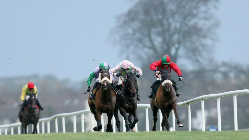 Jockey Bryan Cooper onboard Benefficient leads home Andrew McNamara onboard Hidden Cyclone and Arvika Ligeonniere with jockey Ruby Walsh to win the Paddy Power Chase. Photograph: James Crombie/Inpho