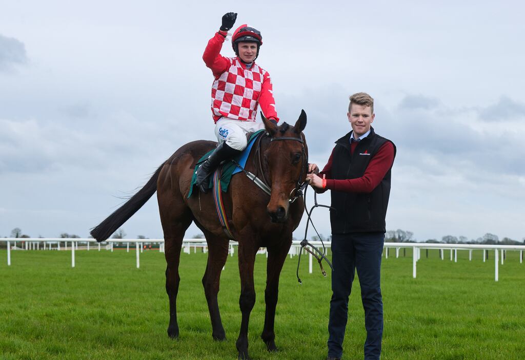 Jockey Seán O’Keefe on Flame Bearer celebrates winning the WilllowWarm Gold Cup Novice Chase at Fairyhouse with groom Paul Roche. Photograph: Tom Maher/Inpho