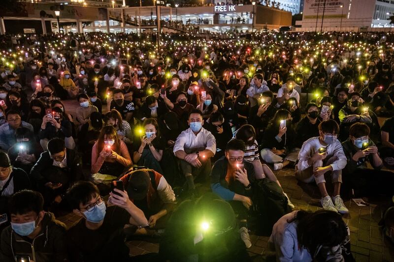 Demonstrators shine lights from smartphones during a rally at Edinburgh Place in the Central district of Hong Kong on Thursday. Photograph: Justin Chin/Bloomberg