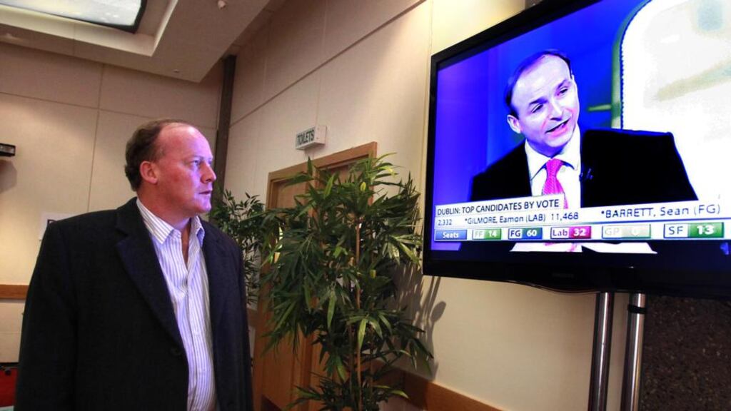 Former  Fianna Fáil TD Conor Lenihan is photographed in RTÉ watching his party leader Micheál Martin being interviewed. Mr Lenihan on Monday said he would consider running for the Dáil again if approached by the party. Photograph: Brenda Fitzsimons/The Irish Times.