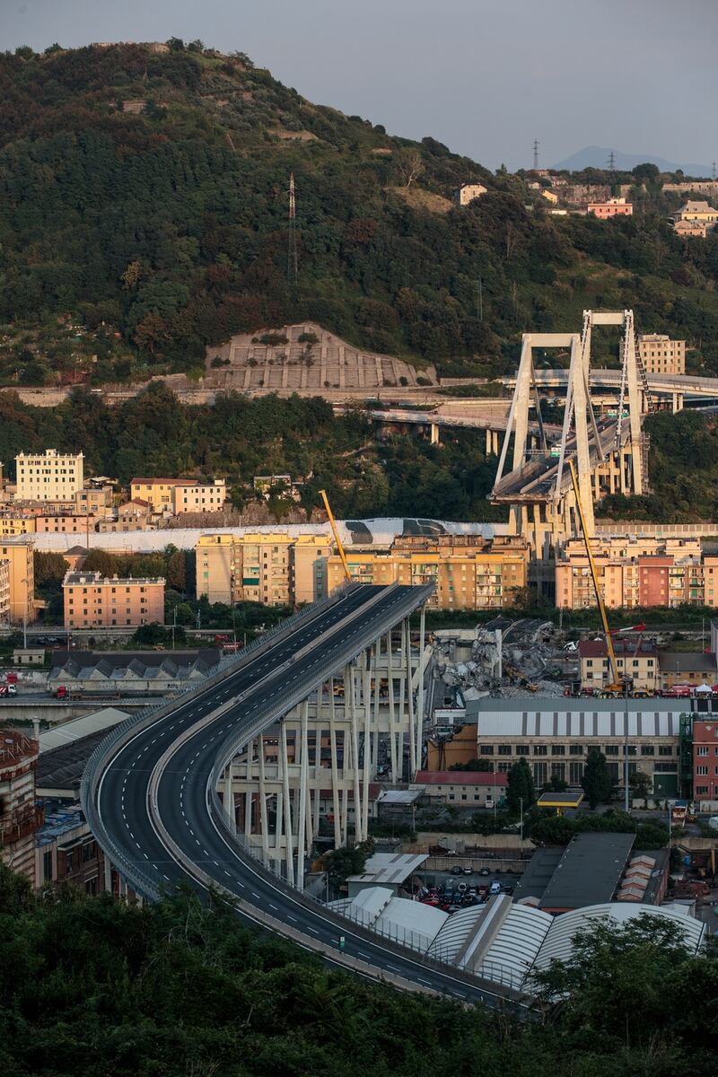 The Morandi Bridge still partially stands after the collapse earlier this week. Rescuers are still attempting to find survivors beneath the rubble. Photograph: Getty Images