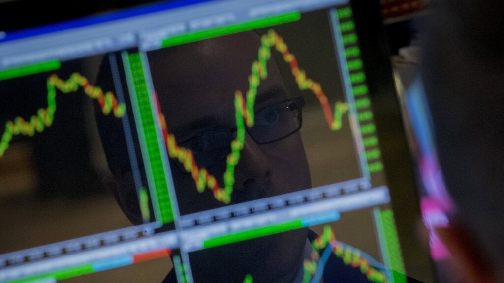 A specialist trader looks at his screen on the floor of the New York Stock Exchange. Photograph: REUTERS/Brendan McDermid