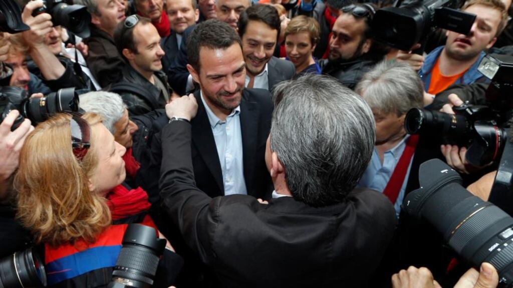 Former Societe Generale trader Jerome Kerviel is hugged by Jean-Luc Melenchon, the leader of the French far-left Parti de Gauche. Photograph: Charles Platiau/Reuters