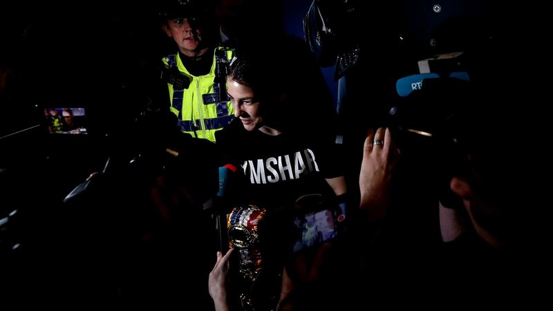 Katie Taylor speaks to the media after arriving back in Dublin. Photograph: Bryan Keane/Inpho